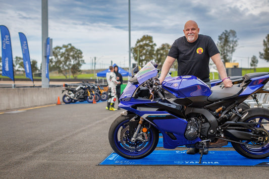 Ross from Biker Torque at Sydney Motorsport Park standing with a blue 2025 Yamaha YZF-R9