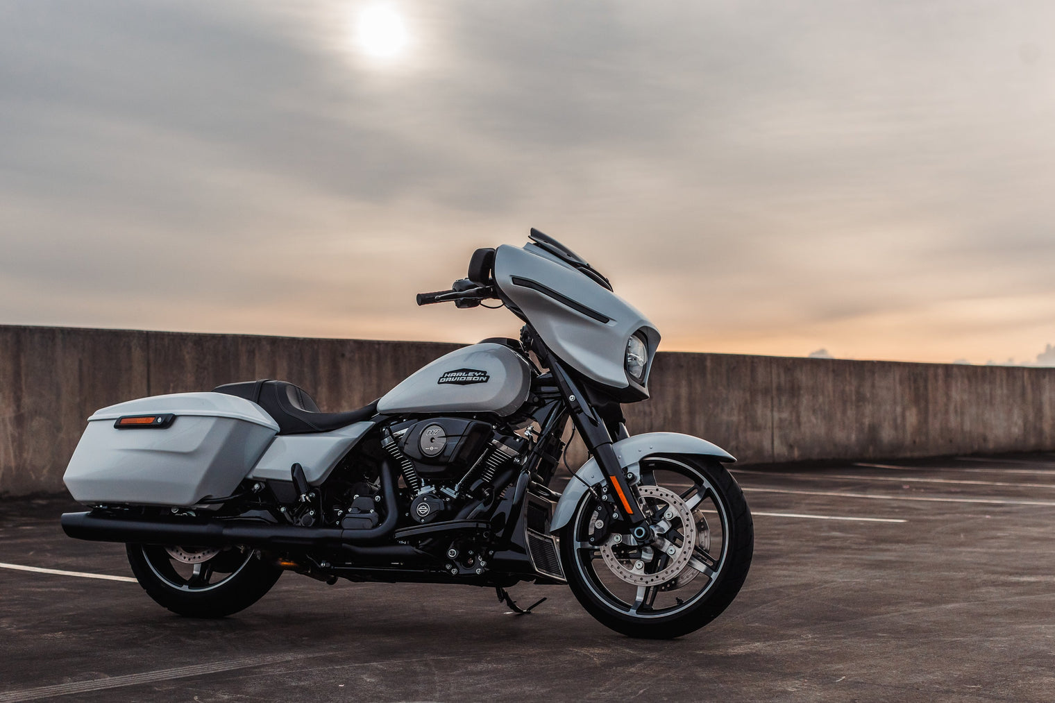 2025 Harley Davidson Street Glide on rooftop carpark with sun in sky