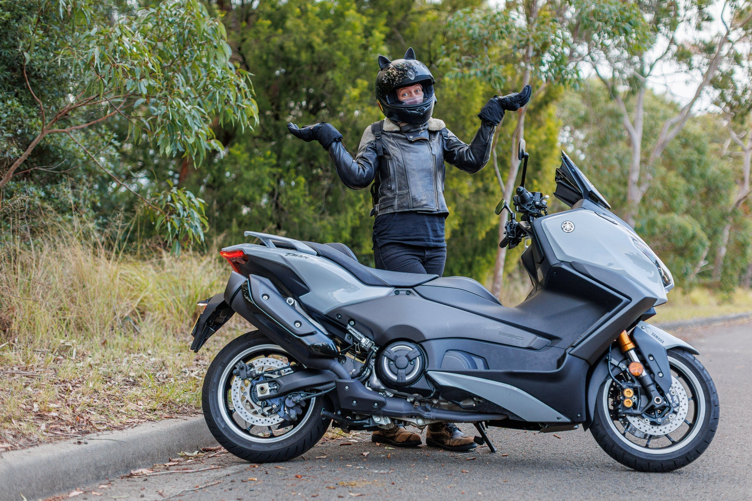 Yamaha T-Max Tach Max with female rider with hands in air