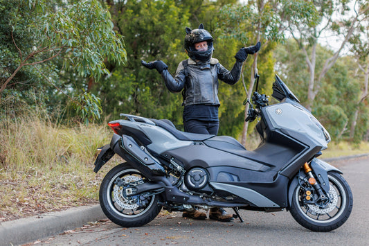 Yamaha T-Max Tach Max with female rider with hands in air