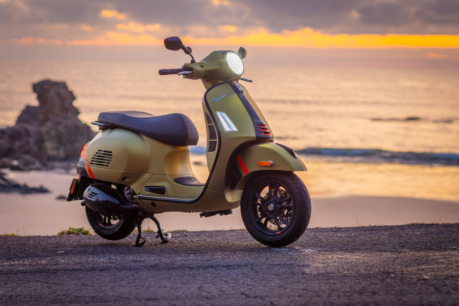 Vespa near the beach at sunrise