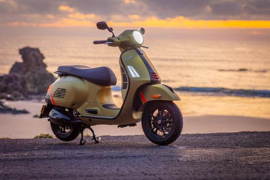 Vespa near the beach at sunrise