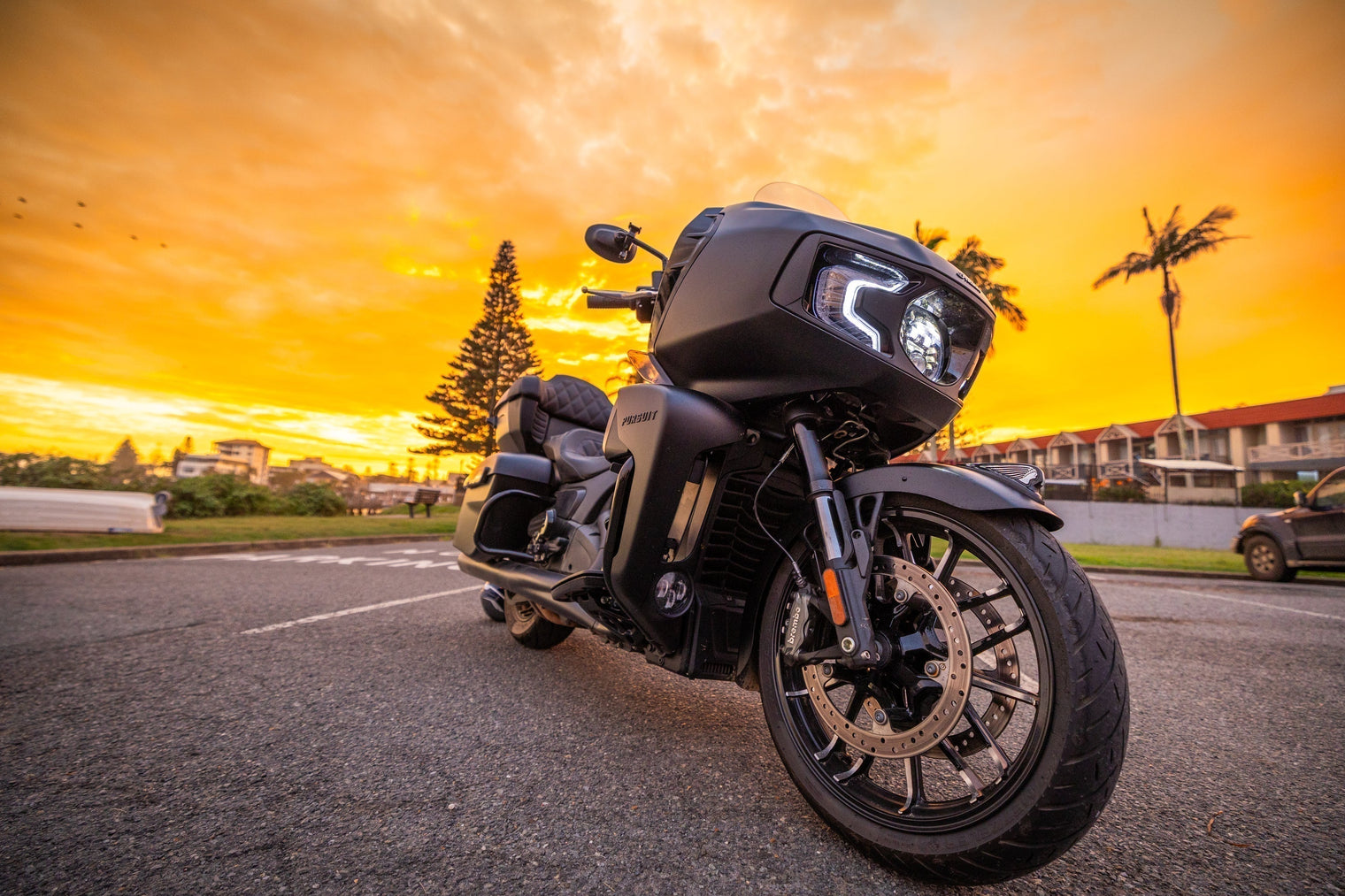 Indian Pursuit Darkhorse at sunrise in a carpark