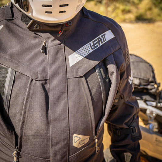 Man in Leatt jacket on a dirt road