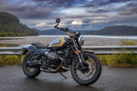 BMW R12 NineT on side of road with storm clouds in the sky