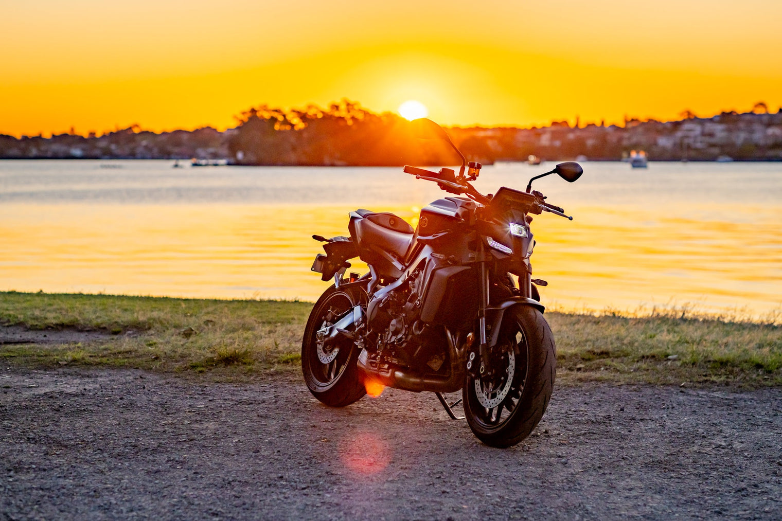 Yamaha MT09 near lake at sunset